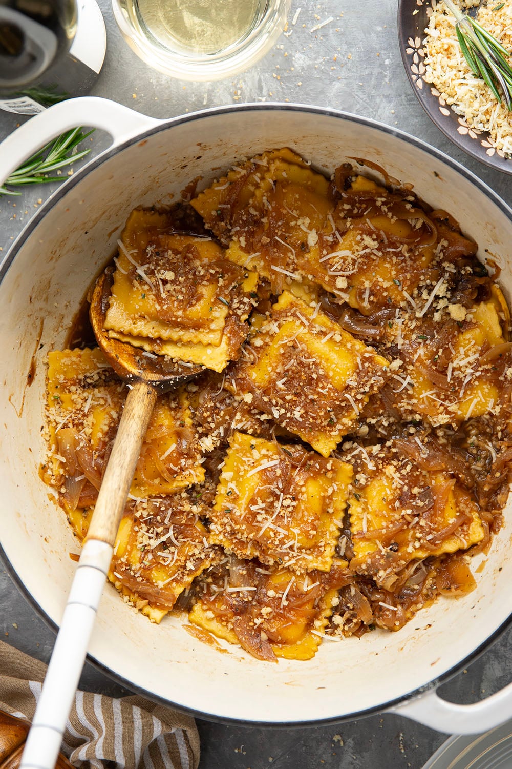 Savory caramelized onions and crispy asiago breadcrumbs dress up this French onion ravioli that makes a great side dish for any holiday meal.