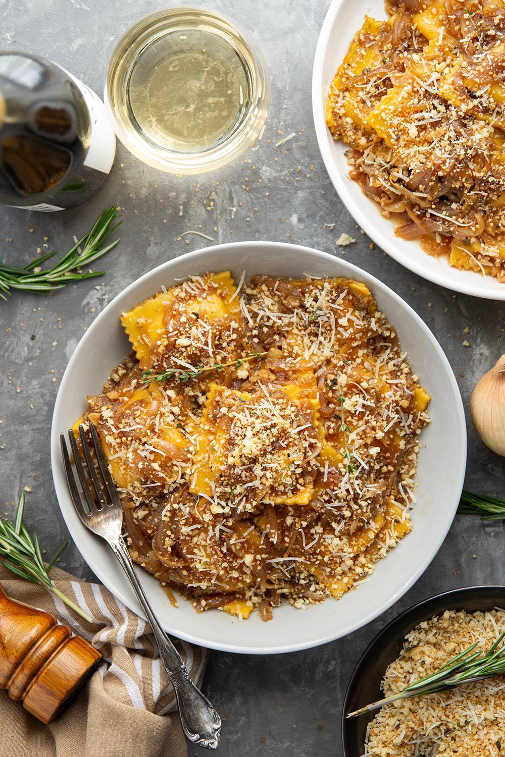 Savory caramelized onions and crispy asiago breadcrumbs dress up this French onion ravioli that makes a great side dish for any holiday meal.