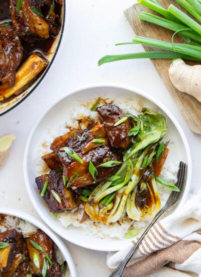Slowly cooked in a flavorful ginger soy broth until fall-apart tender, these soy braised short ribs are easy to put together for a holiday dinner and excellent served over steamed rice with baby bok choy.