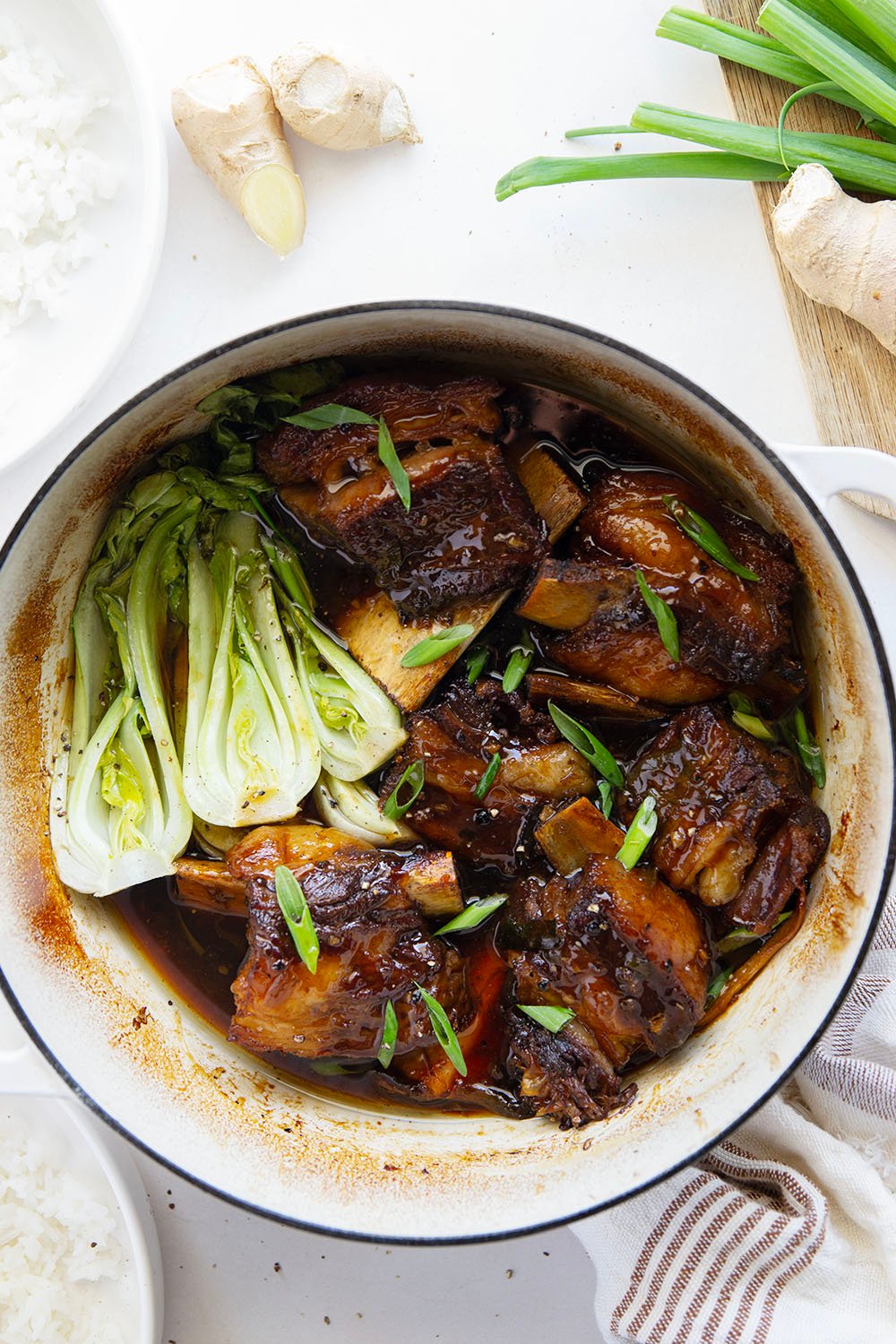 Slowly cooked in a flavorful ginger soy broth until fall-apart tender, these soy braised short ribs are easy to put together for a holiday dinner and excellent served over steamed rice with baby bok choy.