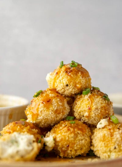 Coated in a crispy panko breading and drizzled with a sweet and spicy hot honey sauce, these goat cheese balls cook up in minutes in the air fryer and are always a winning appetizer.