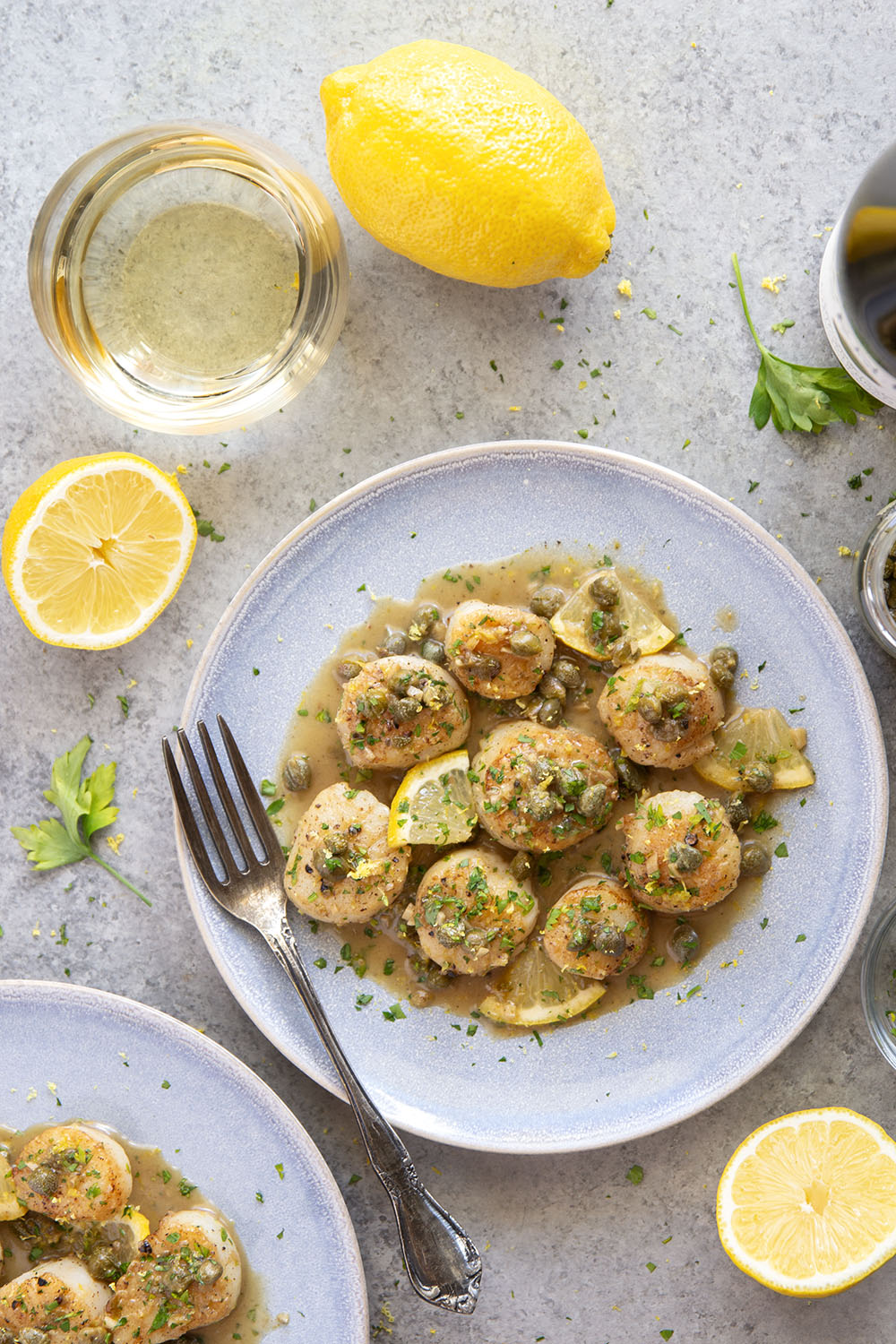 Buttery tender seared scallops with lemon caper sauce have the perfect level of fresh lemon flavor coupled with tangy capers and lots of fresh herbs on top.