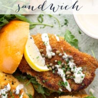 This chicken piccata sandwich feature all the things you love about classic chicken piccata in sandwich form! Fluffy brioche buns with crispy chicken cutlets squeezed with fresh lemon, tangy capers, peppery argula, and a creamy lemon aioli.