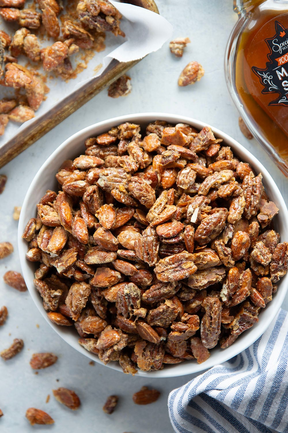 Roasted to perfection in maple syrup and spices, these maple candied pecans and almonds make the ultimate holiday snack or gift!