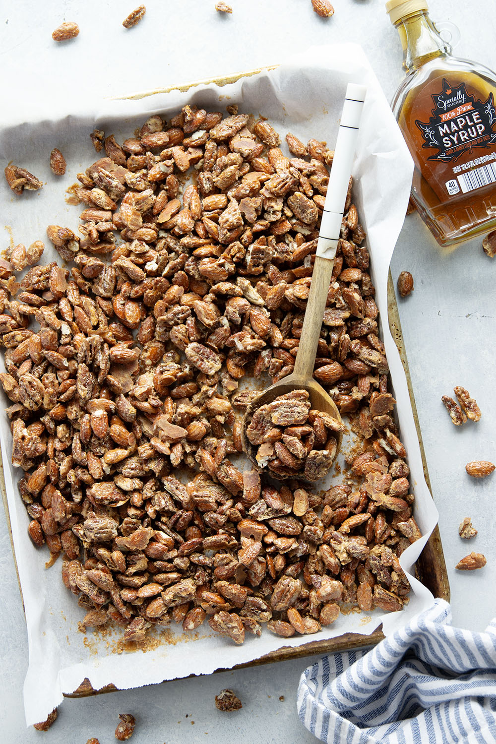 Roasted to perfection in maple syrup and spices, these maple candied pecans and almonds make the ultimate holiday snack or gift!