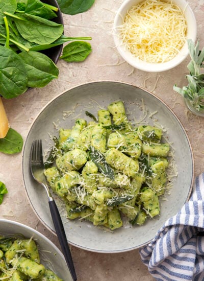 Light and fluffy homemade spinach gnocchi is packed with vibrant fresh spinach and tossed in a sage browned butter and lots of fresh Parmesan.