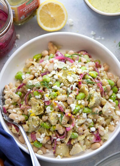 A tangy fresh dill feta dressing coats every inch of this colorful artichoke white bean salad that's packed with fresh flavors and lots of texture.