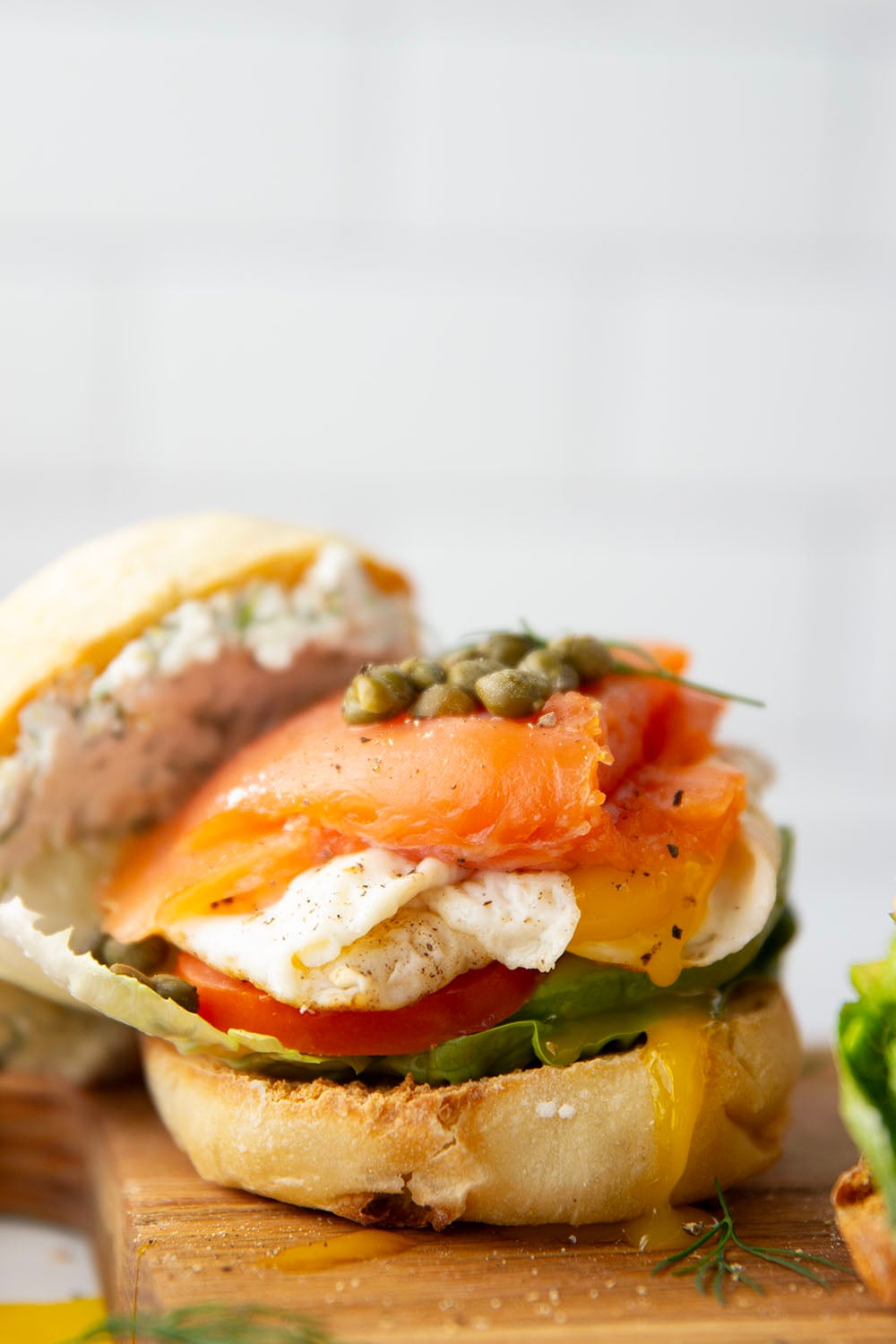 A creamy herbed goat cheese spread and all the breakfast works are packed into this hearty smoked salmon breakfast sandwich.