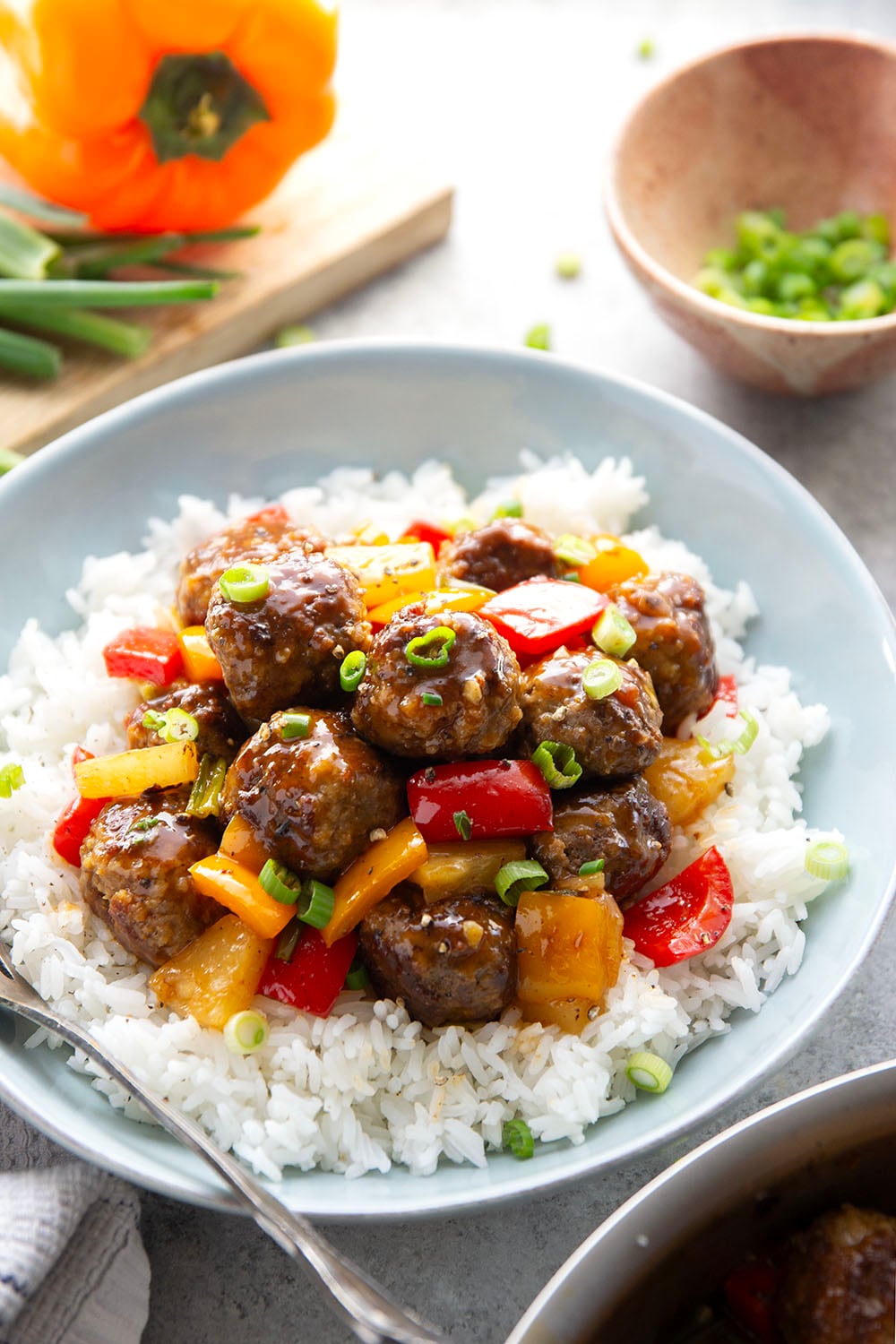 A homemade sweet and sour sauce coats every inch of these juicy sweet and sour meatballs that cook up with colorful peppers and sweet pineapple all in one pan.