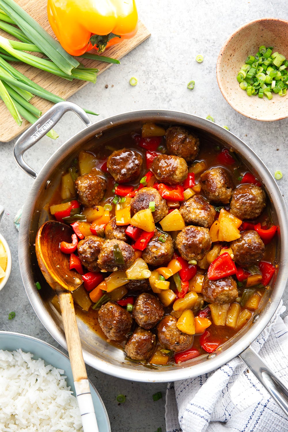 A homemade sweet and sour sauce coats every inch of these juicy sweet and sour meatballs that cook up with colorful peppers and sweet pineapple all in one pan.