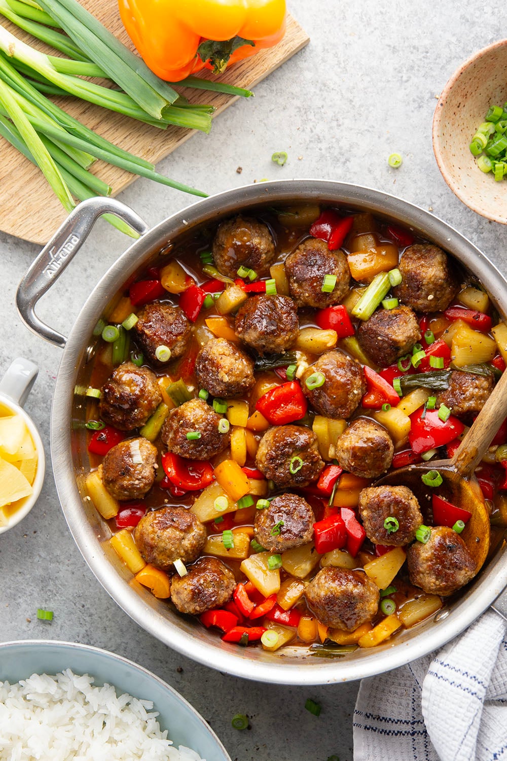 A homemade sweet and sour sauce coats every inch of these juicy sweet and sour meatballs that cook up with colorful peppers and sweet pineapple all in one pan.