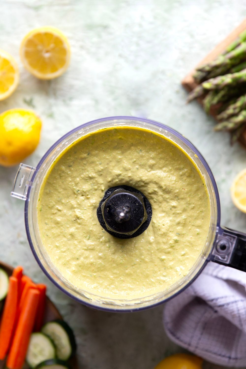 Vibrant spring peas and asparagus are the best spring twist on hummus! This asparagus pea hummus is silky smooth and pairs wonderfully with fresh vegetables and pita chips for dipping.