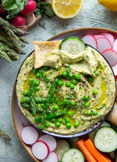 Vibrant spring peas and asparagus are the best spring twist on hummus! This asparagus pea hummus is silky smooth and pairs wonderfully with fresh vegetables and pita chips for dipping.