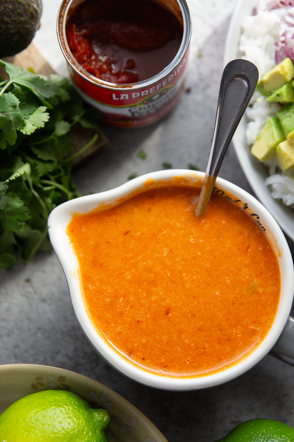 This black bean rice salad features fluffy steamed rice with black beans, sweet peppers, and avocado dressed in a sweet and spicy honey chipotle dressing.