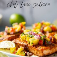 Marinated in a fresh lime and chili sauce, grilled to perfection, and topped with a super fresh mango salsa, this grilled chili lime salmon is an easy dinner that's full of flavor!