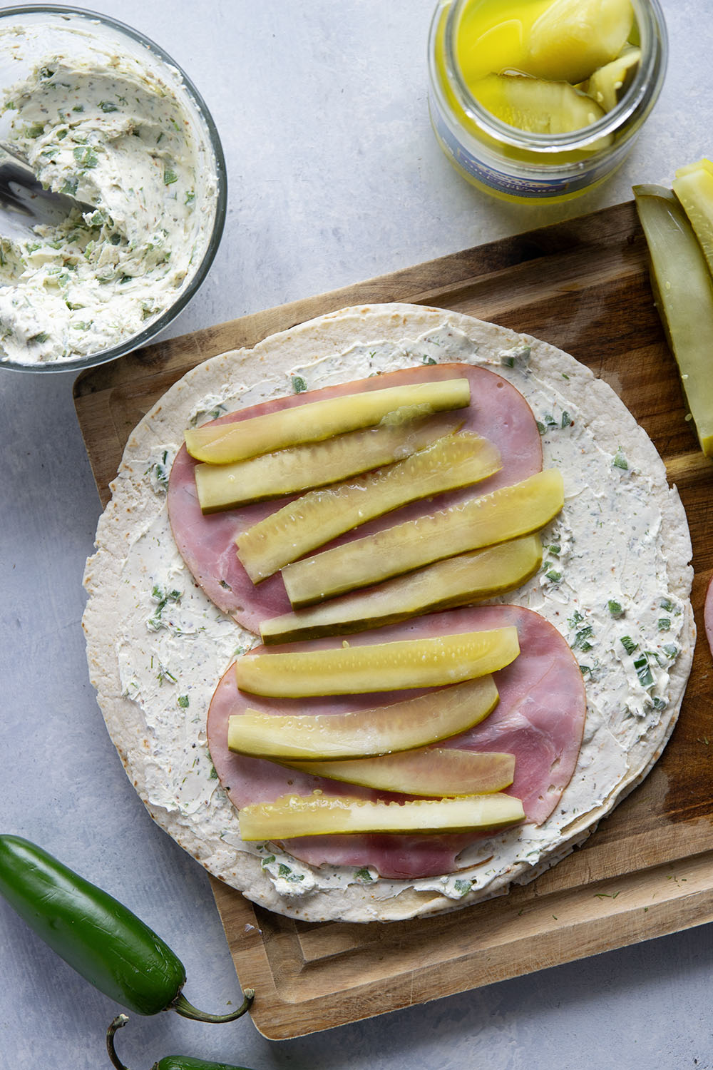 Stuffed with tender ham slices, sliced dill pickle spears, and a spicy jalapeno cream cheese, these dill pickle pinwheels are a quick appetizer that everyone always loves!