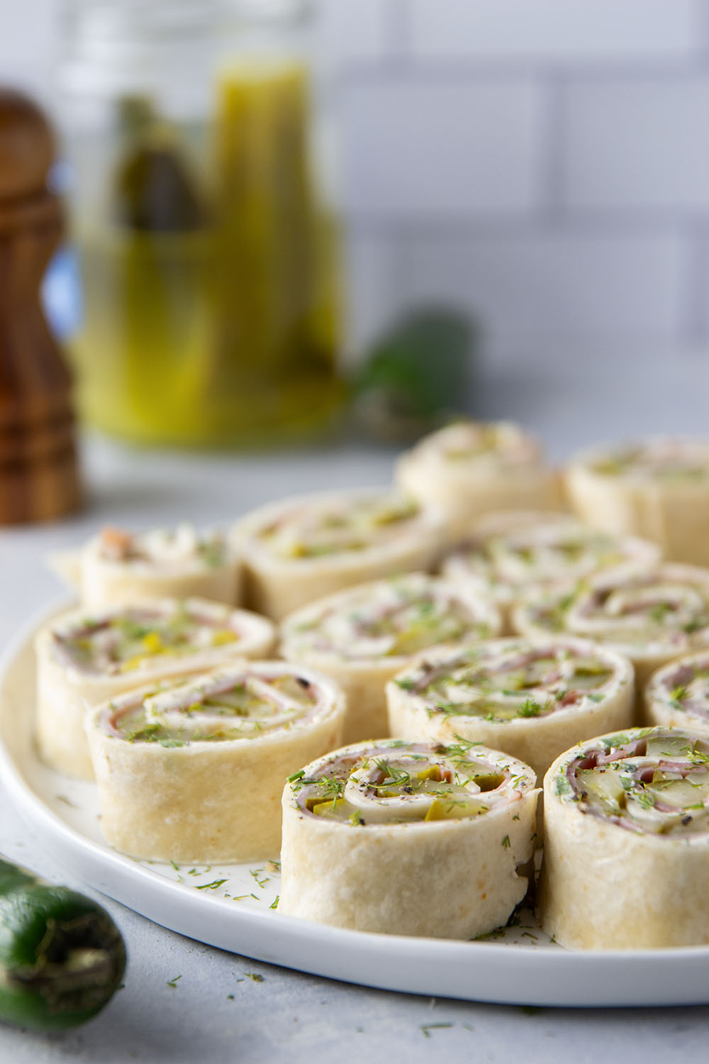 Stuffed with tender ham slices, sliced dill pickle spears, and a spicy jalapeno cream cheese, these dill pickle pinwheels are a quick appetizer that everyone always loves!