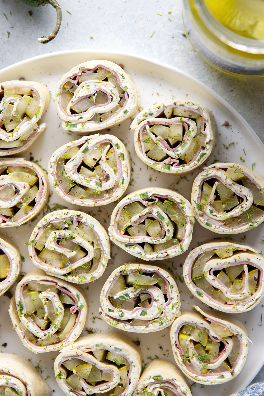 Stuffed with tender ham slices, sliced dill pickle spears, and a spicy jalapeno cream cheese, these dill pickle pinwheels are a quick appetizer that everyone always loves!