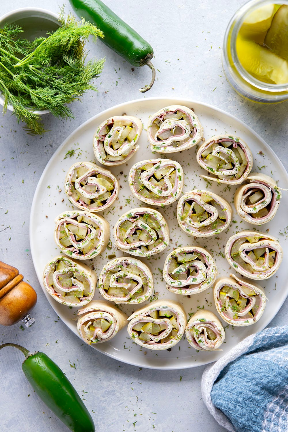 Stuffed with tender ham slices, sliced dill pickle spears, and a spicy jalapeno cream cheese, these dill pickle pinwheels are a quick appetizer that everyone always loves!