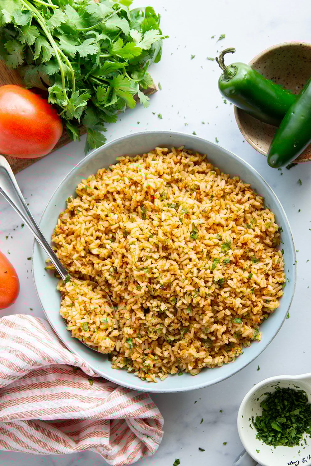 Made entirely in the instant pot in minutes and a close replica of restaurant-style Mexican rice, this instant pot Mexican rice is perfectly fluffy and packed with flavor!