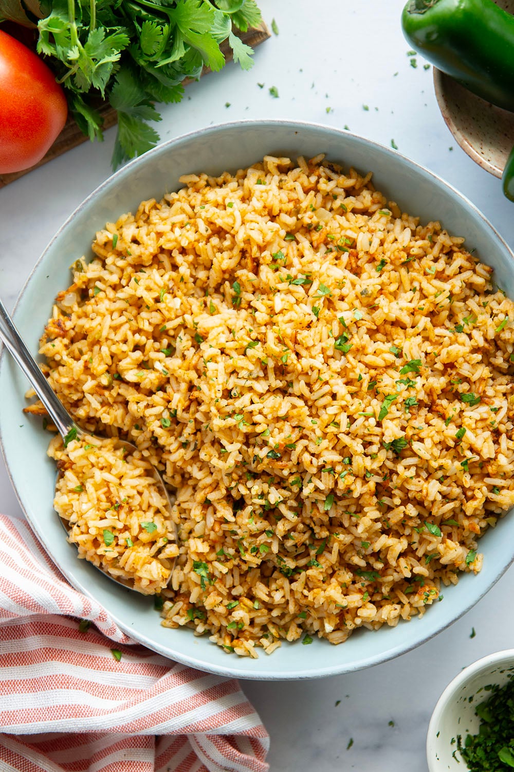 Made entirely in the instant pot in minutes and a close replica of restaurant-style Mexican rice, this instant pot Mexican rice is perfectly fluffy and packed with flavor!