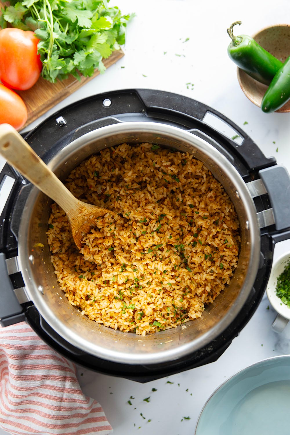 Made entirely in the instant pot in minutes and a close replica of restaurant-style Mexican rice, this instant pot Mexican rice is perfectly fluffy and packed with flavor!