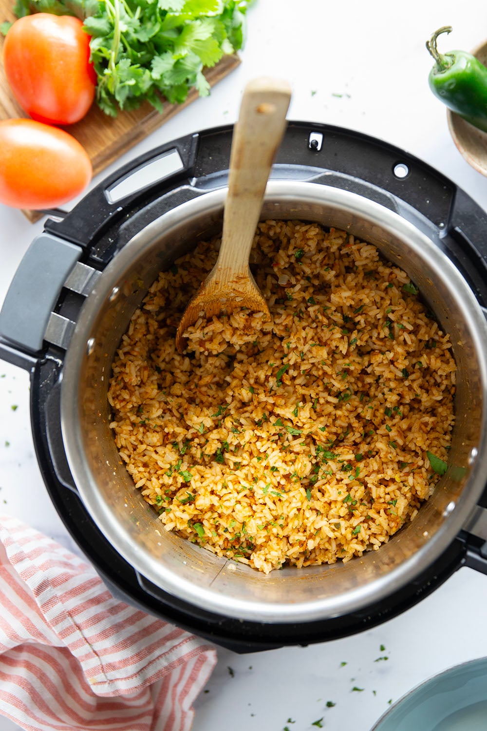 Made entirely in the instant pot in minutes and a close replica of restaurant-style Mexican rice, this instant pot Mexican rice is perfectly fluffy and packed with flavor!