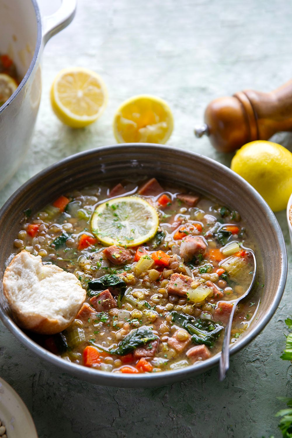 Tender lentils and lots of fresh lemon jazz up this hearty lentil ham soup that comes together all in one pot and is the best use for leftover ham!