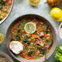 Tender lentils and lots of fresh lemon jazz up this hearty lentil ham soup that comes together all in one pot and is the best use for leftover ham!