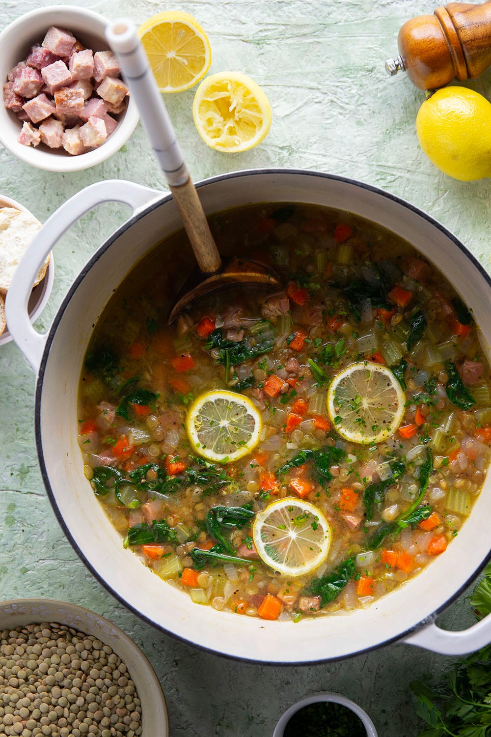 Tender lentils and lots of fresh lemon jazz up this hearty lentil ham soup that comes together all in one pot and is the best use for leftover ham!