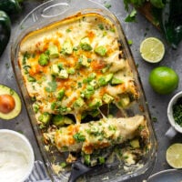 Flavorful poblanos and ground turkey make up a hearty filling in these ground turkey enchiladas that bake up with a cheesy white enchilada sauce on top and lots of toppings.