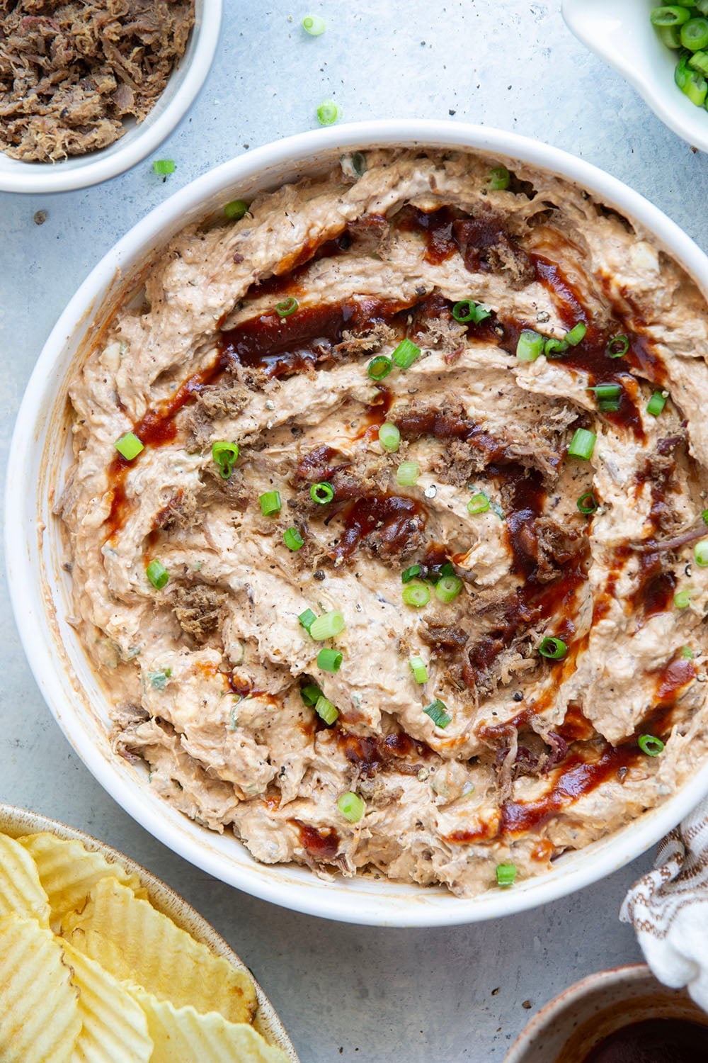Leftover brisket is the perfect meaty base for this creamy, flavorful BBQ beef brisket dip that goes great with chips, crackers, or as sandwich spread!