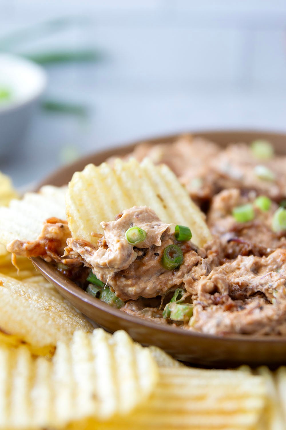 Leftover brisket is the perfect meaty base for this creamy, flavorful BBQ beef brisket dip that goes great with chips, crackers, or as sandwich spread!