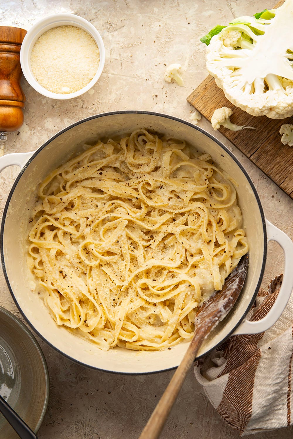Indulge in a creamy, silky alfredo sauce for a fraction of the calories in this cauliflower alfredo sauce version! NO heavy cream needed and it's made in minutes on the stovetop.