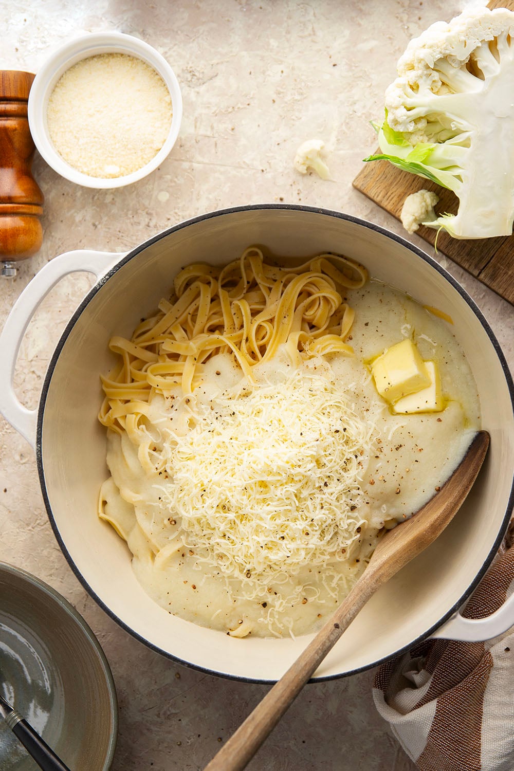 Indulge in a creamy, silky alfredo sauce for a fraction of the calories in this cauliflower alfredo sauce version! NO heavy cream needed and it's made in minutes on the stovetop.