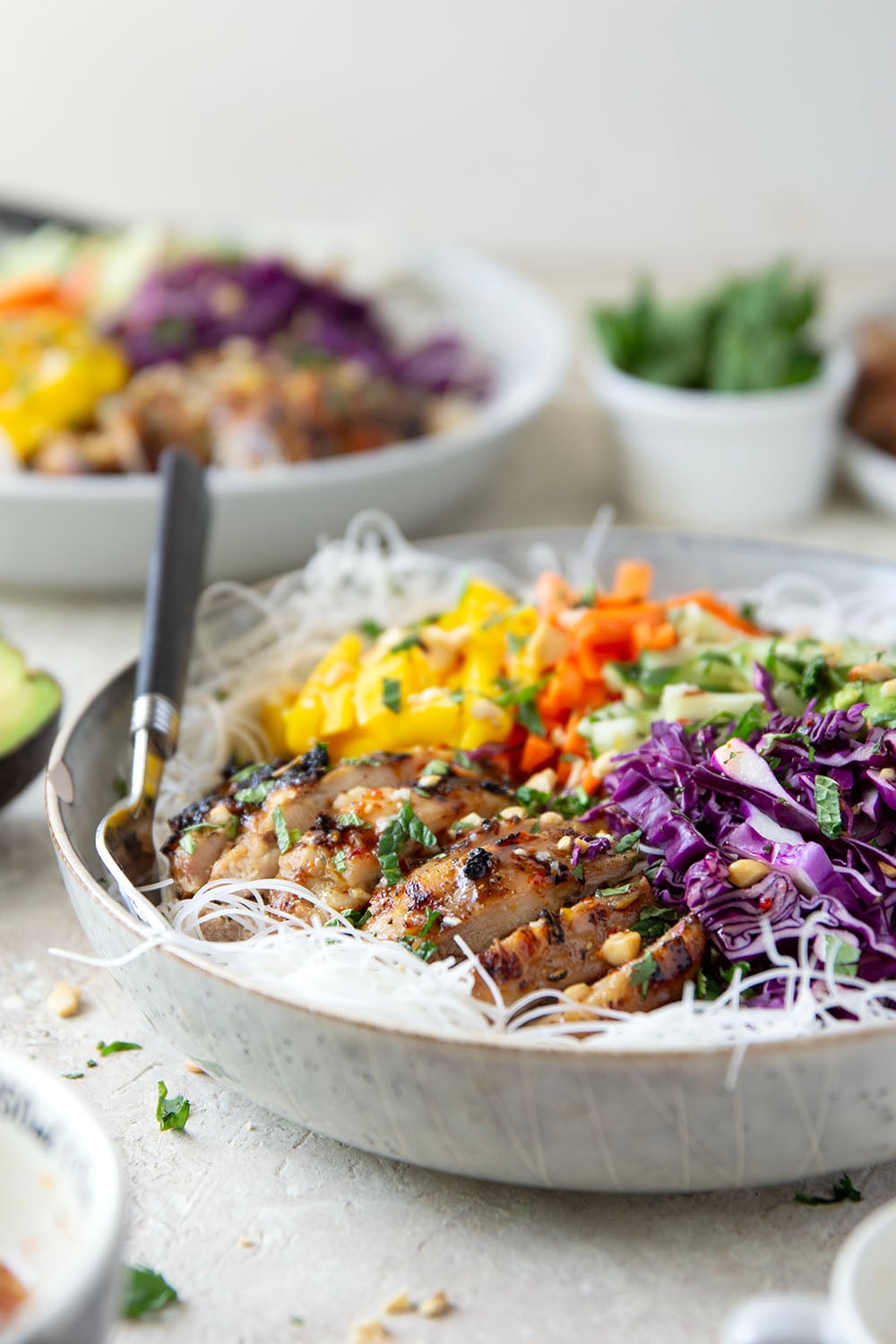Lemongrass marinated grilled chicken and all the fresh spring roll ingredients collide in these colorful spring roll bowls. Easy to prep ahead for healthy lunches or dinners!