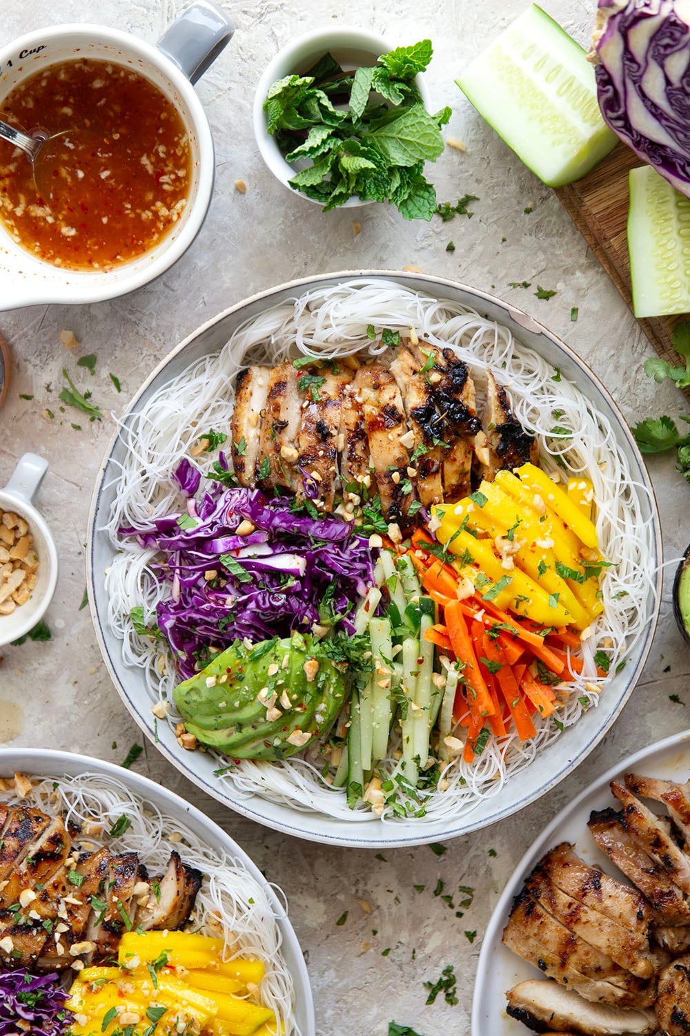 Lemongrass marinated grilled chicken and all the fresh spring roll ingredients collide in these colorful spring roll bowls. Easy to prep ahead for healthy lunches or dinners!
