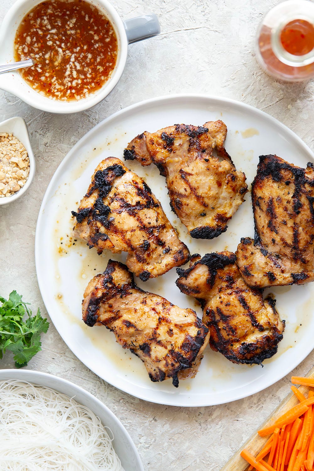 Lemongrass marinated grilled chicken and all the fresh spring roll ingredients collide in these colorful spring roll bowls. Easy to prep ahead for healthy lunches or dinners!