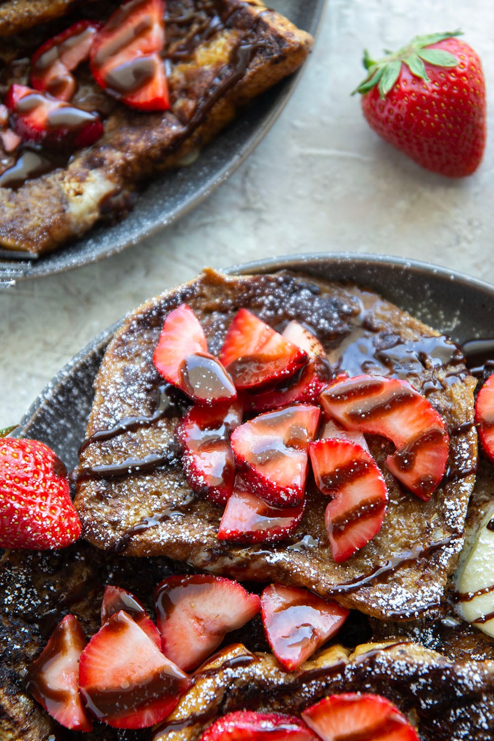 This stunning espresso chocolate French toast is a mocha-lover's dream! Serve slices hot off the griddle with fresh strawberry sauce and plenty of chocolate syrup.