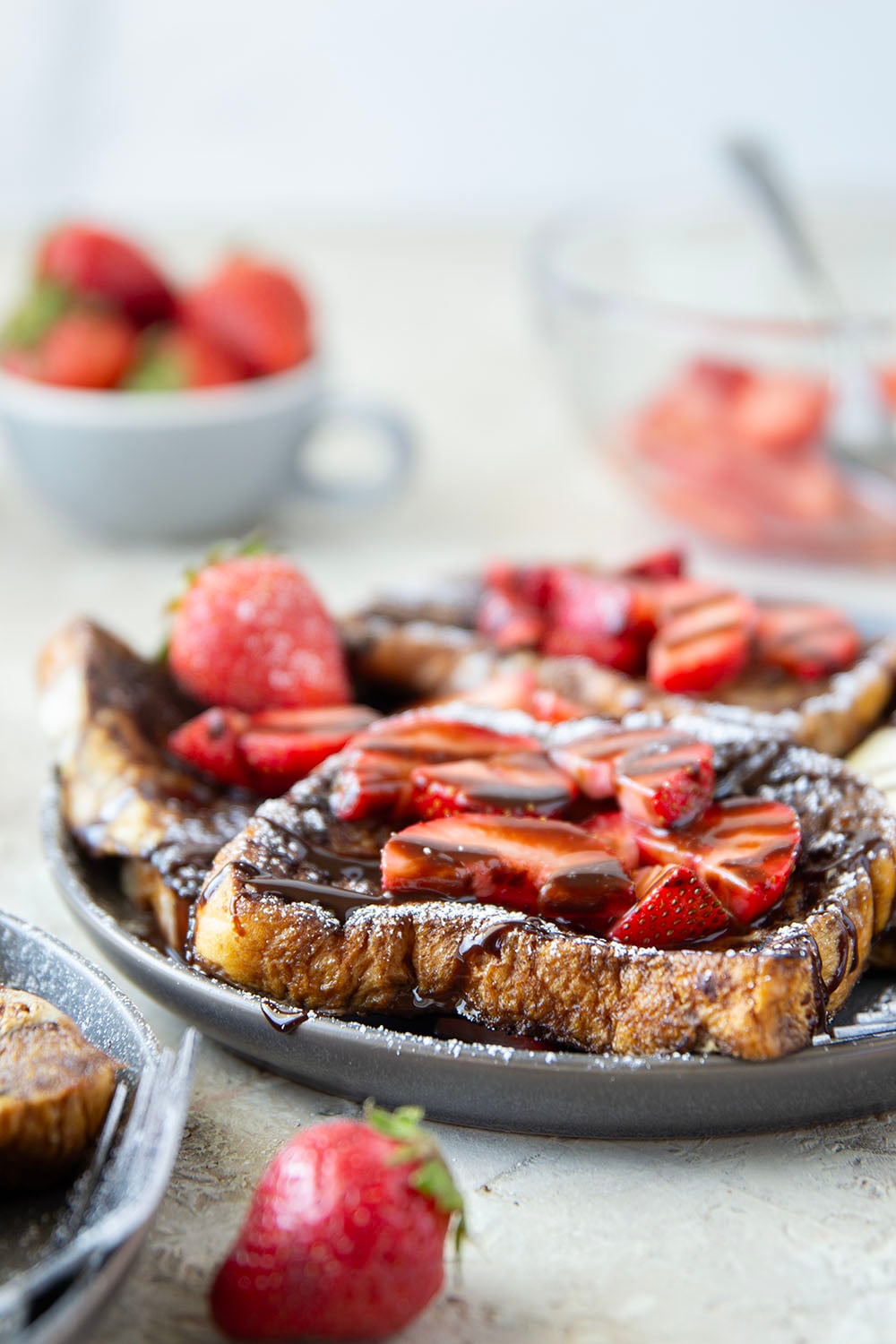 This stunning espresso chocolate French toast is a mocha-lover's dream! Serve slices hot off the griddle with fresh strawberry sauce and plenty of chocolate syrup.