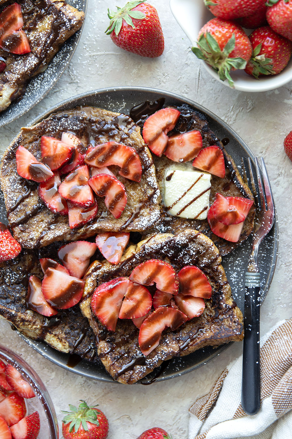 This stunning espresso chocolate French toast is a mocha-lover's dream! Serve slices hot off the griddle with fresh strawberry sauce and plenty of chocolate syrup.