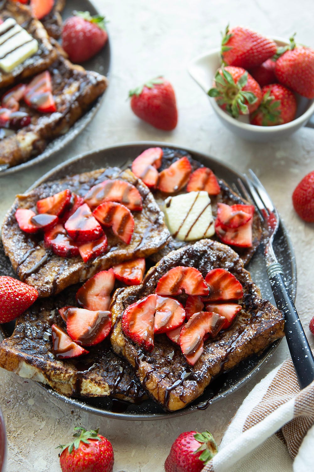This stunning espresso chocolate French toast is a mocha-lover's dream! Serve slices hot off the griddle with fresh strawberry sauce and plenty of chocolate syrup.