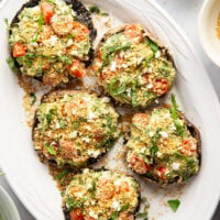 These stuffed portobello mushrooms include a fresh cherry tomato spinach feta filling stuffed into tender portobello caps and grilled for just a few minutes until perfectly tender and smoky.