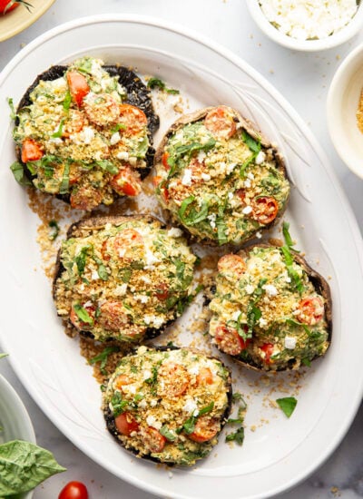These stuffed portobello mushrooms include a fresh cherry tomato spinach feta filling stuffed into tender portobello caps and grilled for just a few minutes until perfectly tender and smoky.