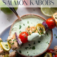Marinated in a fresh cilantro lime sauce and grilled alongside red onion, cherry tomatoes, and served with a cilantro lime crema, these cilantro lime grilled salmon kabobs are a quick dinner to throw on the grill for any occasion.