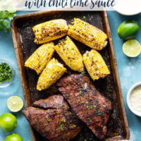 Spice-rubbed grilled flank steak and corn is an easy summer dish that pairs very well with a creamy chili lime sauce drizzled on top.