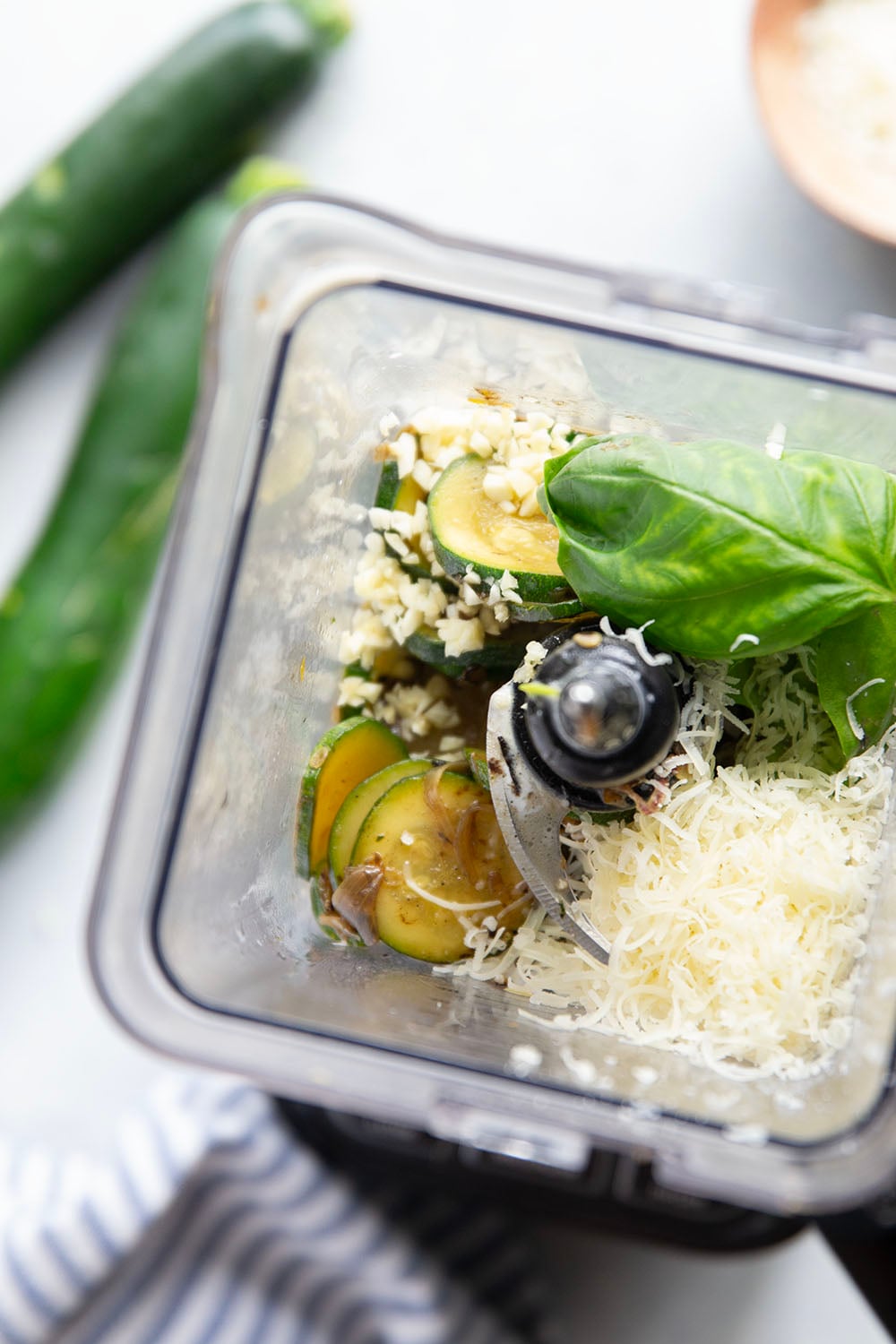 Sauteed zucchini gets blended down into a super creamy and velvety sauce along with lots of fresh basil and Parmesan cheese in this creamy zucchini pasta.
