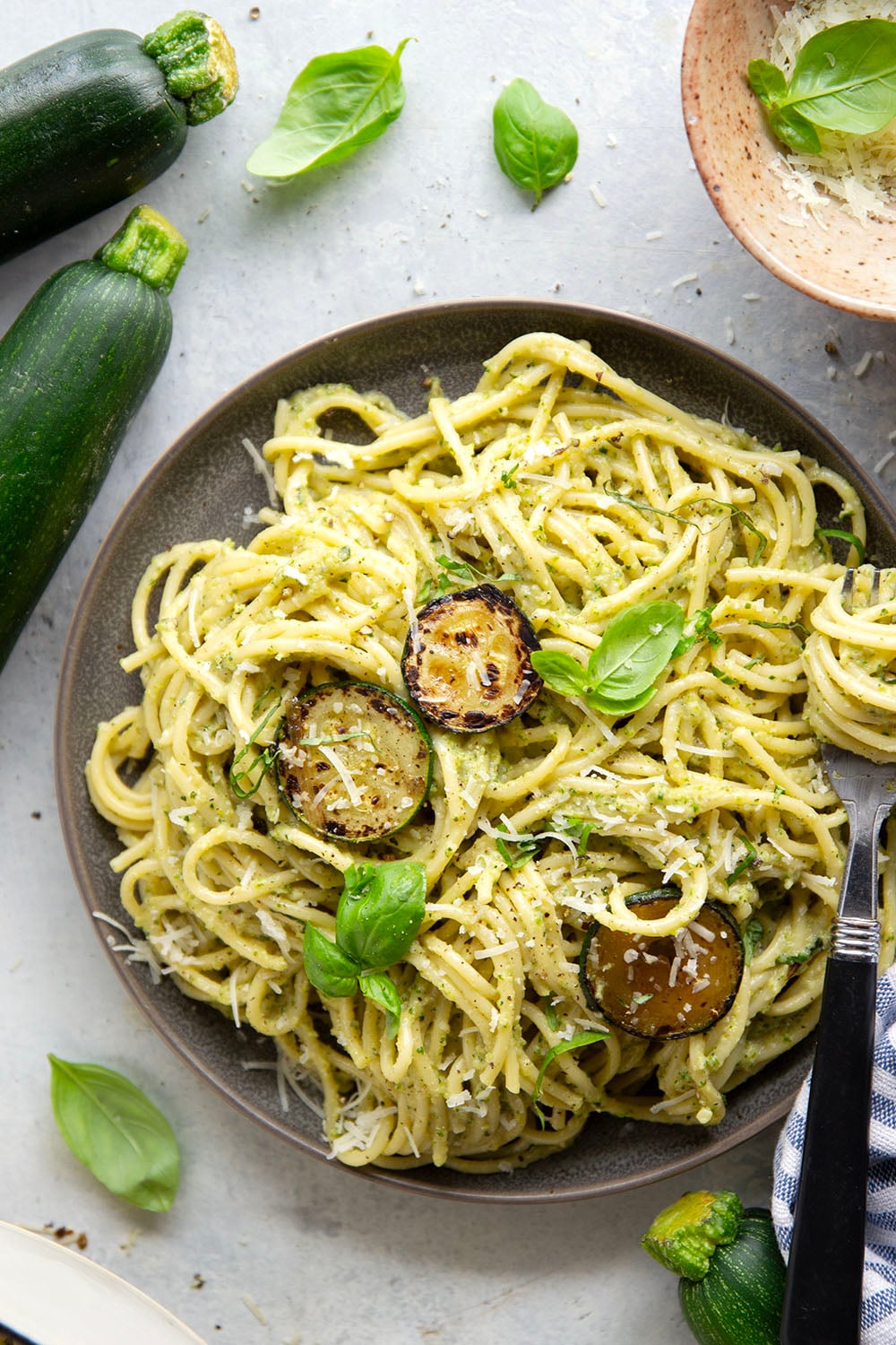 Sauteed zucchini gets blended down into a super creamy and velvety sauce along with lots of fresh basil and Parmesan cheese in this creamy zucchini pasta.