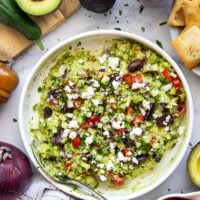Packed with fresh Greek-inspired ingredients and ready in minutes, this Greek guacamole is unbelievably fresh-tasting and goes great with pita chips for dipping.