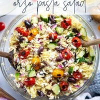 This colorful Greek orzo pasta salad is loaded with plenty of charred cherry tomatoes, crunchy cucumbers, lots of fresh feta, and tossed in a flavorful red wine vinaigrette for one stunning summer salad!